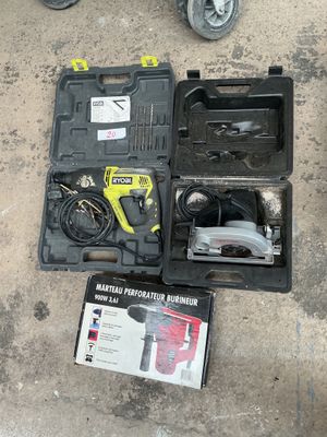 a tool box with a hammer and other tools on the ground
