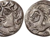 a silver coin with a woman ' s face on it