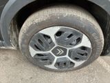 a close up of a tire on the side of a car
