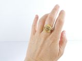 a woman ' s hand with a ring on it ' s finger