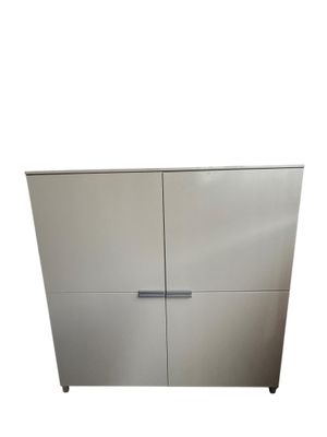 a close up of a stainless steel cabinet with two doors