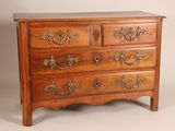 an image of a wooden chest of drawers with brass handles