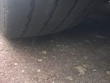 the tire of a car with a flat tire on the ground