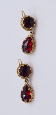 three pairs of garnets with red stones on them