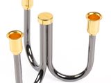 pair of black and gold candlesticks on a white background