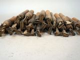 a pile of wood sticks on a white surface