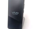 a cell phone that is sitting on top of a stand