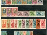 une collection de timbres provenant de différents pays, sur lesquels figurent notamment l'image d'un homme et d'une femme