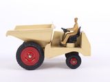 a small toy truck with a man sitting in it