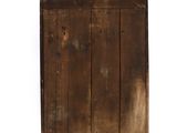 an old wooden cabinet with a mirror on the top of it