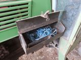 a green machine that has a bunch of blue wires in it