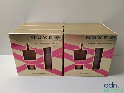 deux boîtes de produits cosmétiques Nuxe posées sur une table devant un fond blanc