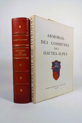 two books sitting next to each other on a white surface