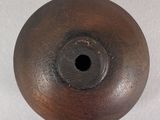 an image of a wooden object with a hole in the middle