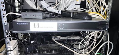a rack of wires and cables in a server