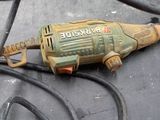 a drill that is sitting on a table with wires