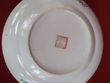 a plate and a bowl sitting on a table