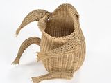 a wicker basket that has a large fish on it