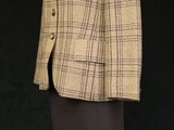 an image of a mannequin wearing a jacket and skirt