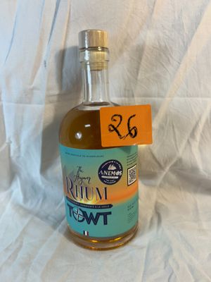 a bottle of ketchup sitting on a white sheet