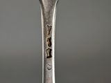 a fork with a piece of food on the end of it
