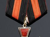 an image of a medal with a cross on the front of it