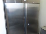 two stainless steel refrigerators in a kitchen next to each other