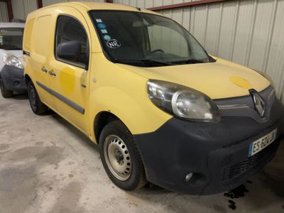 the yellow van is parked in the garage next to other cars