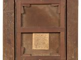 an old wooden picture frame with a piece of paper in it