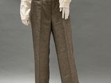 an image of a mannequin wearing a white shirt and brown pants