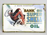an old tin sign advertising a bank on super shell motor lubriating oil