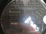 a close up of a metal plate with a name on it