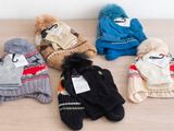 several stuffed animals are lined up on a wooden table