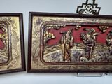 two framed pictures of a couple of people on a wall