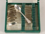 a box with a set of silver spoons and spoon spoons in it