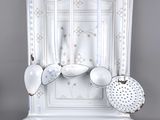 a picture of a white plate holder with spoons and spoons