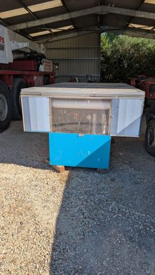 an image of a truck with a cooler in the back of it