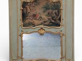 an image of a mirror with a painting on it and a painting on the back of it