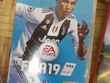 two nintendo wii games on a table with a wii controller