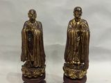 pair of antique brass figurines of a monk and a monk