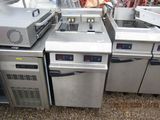 many different types of commercial fryers in this kitchen