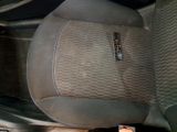 a picture of a car seat with a remote control in it