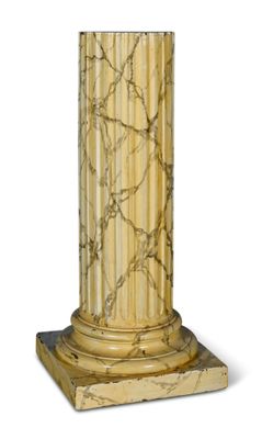 une image représentant un socle en marbre surmonté d'une colonne en marbre