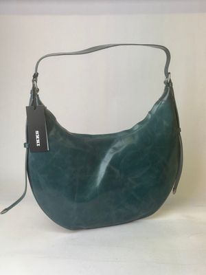 the purse is green and has a black tag on it