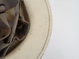 a close up of a helmet on a white surface