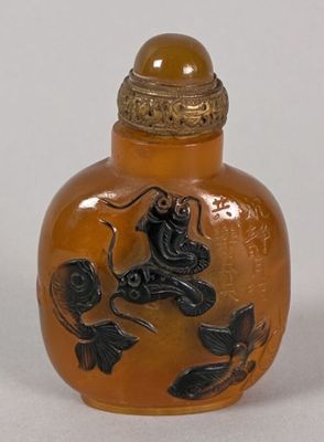 a small glass bottle with a design on it