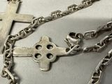 a cross on a chain with a cross on it