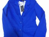 a close up of a blue blazer jacket on a table