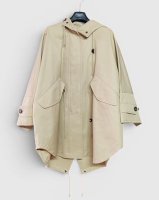 an image of a jacket hanging on a hanger on a wall