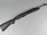 a gun that is laying on top of a table